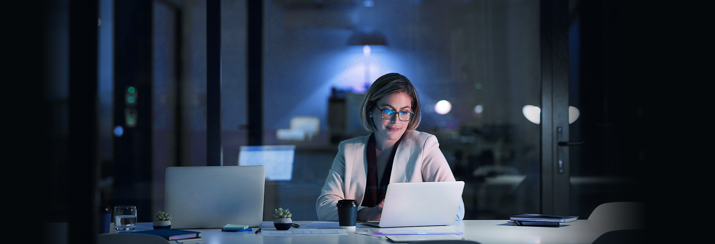 Woman looking at computer in office