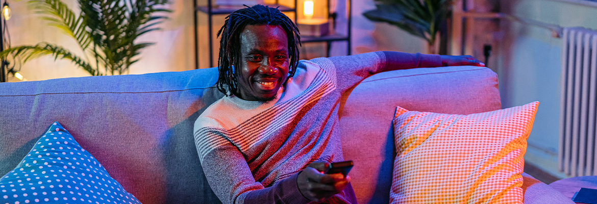 Man watching tv on couch